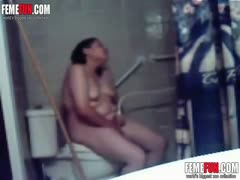 My kinky overweight wife is caught masturbating in the toilet by a hidden camera.